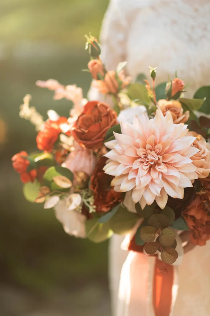 Autumn bride holding flowers wedding props